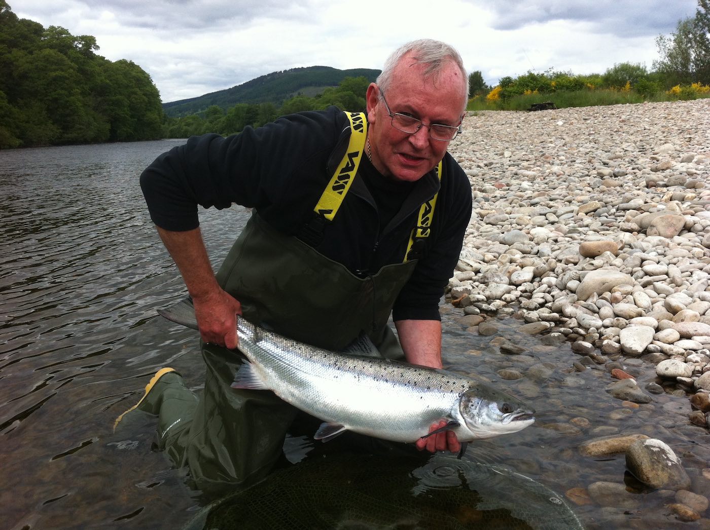 This fine Spring salmon was caught at the Meetings Pool on the Lower Kinnaird Beat of the River Tay by this salmon fishing holiday customer. I was his dedicated salmon fishing guide when I took this lovely upstream shot. Look at the perfect silver flanks of this River Tay salmon.