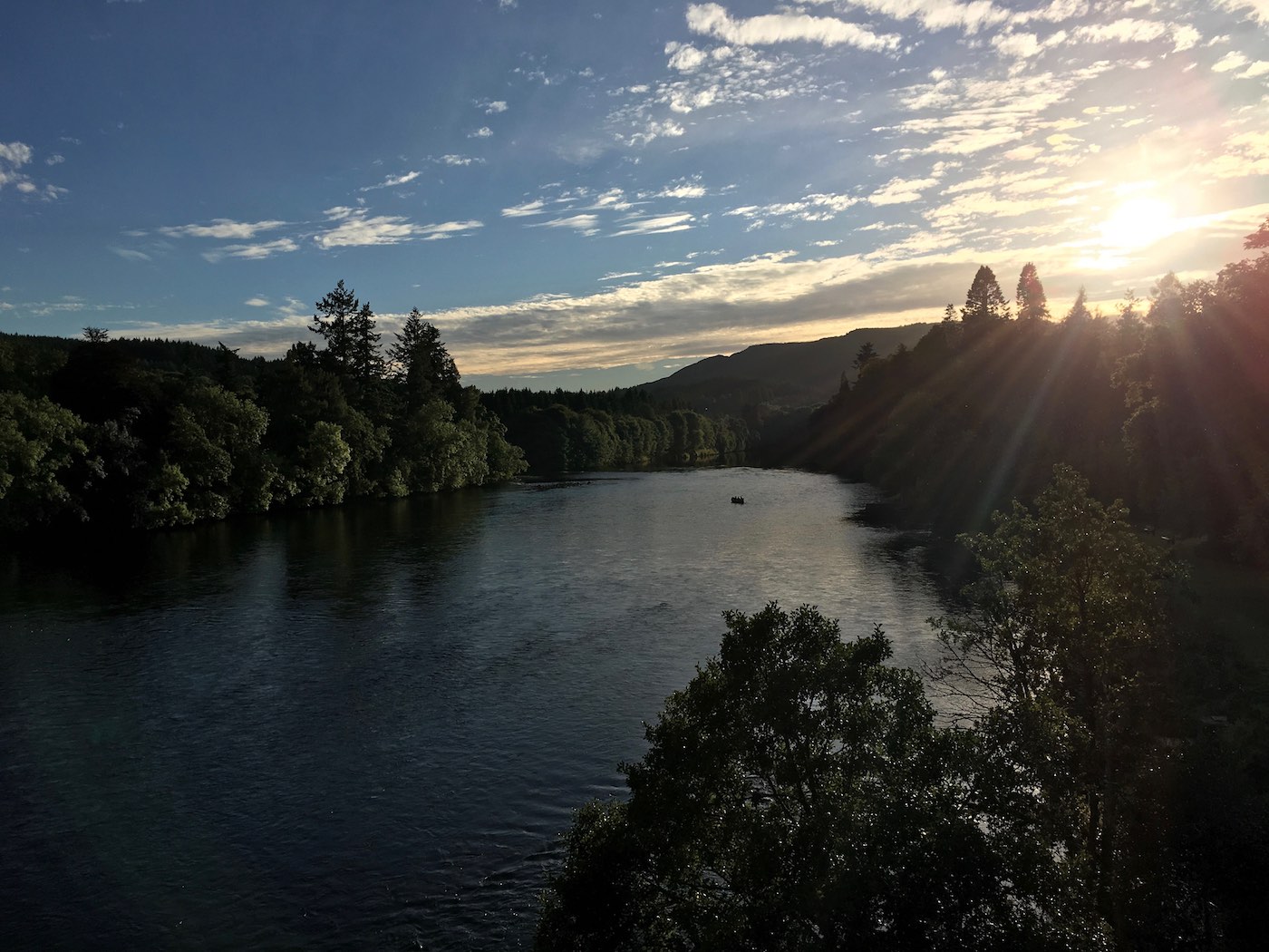 Here's a traditional River Tay salmon boat out fishing the Cathedral Stream at Dunkeld during the last hour of daylight. The sun is about to set over the Perthshire hills which it did 15 minutes after this lovely shot was taken from the Telford Bridge in Dunkeld.