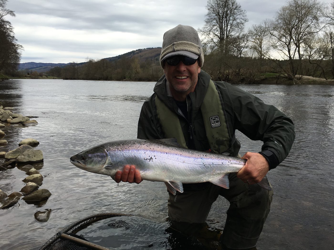 This perfect Spring salmon was caught on a dull light early Spring salmon fishing day on the River Tay near Pitlochry. A fresh run Spring salmon like this isn't that bothered about the poor light conditions as it clearly still had it's oceanic hunting mindset when it took this American salmon fishing holiday angler's fly. Personally, as a salmon fishing guide I prefer a little bit of sunlight during the early season but often salmon like this one think differently!