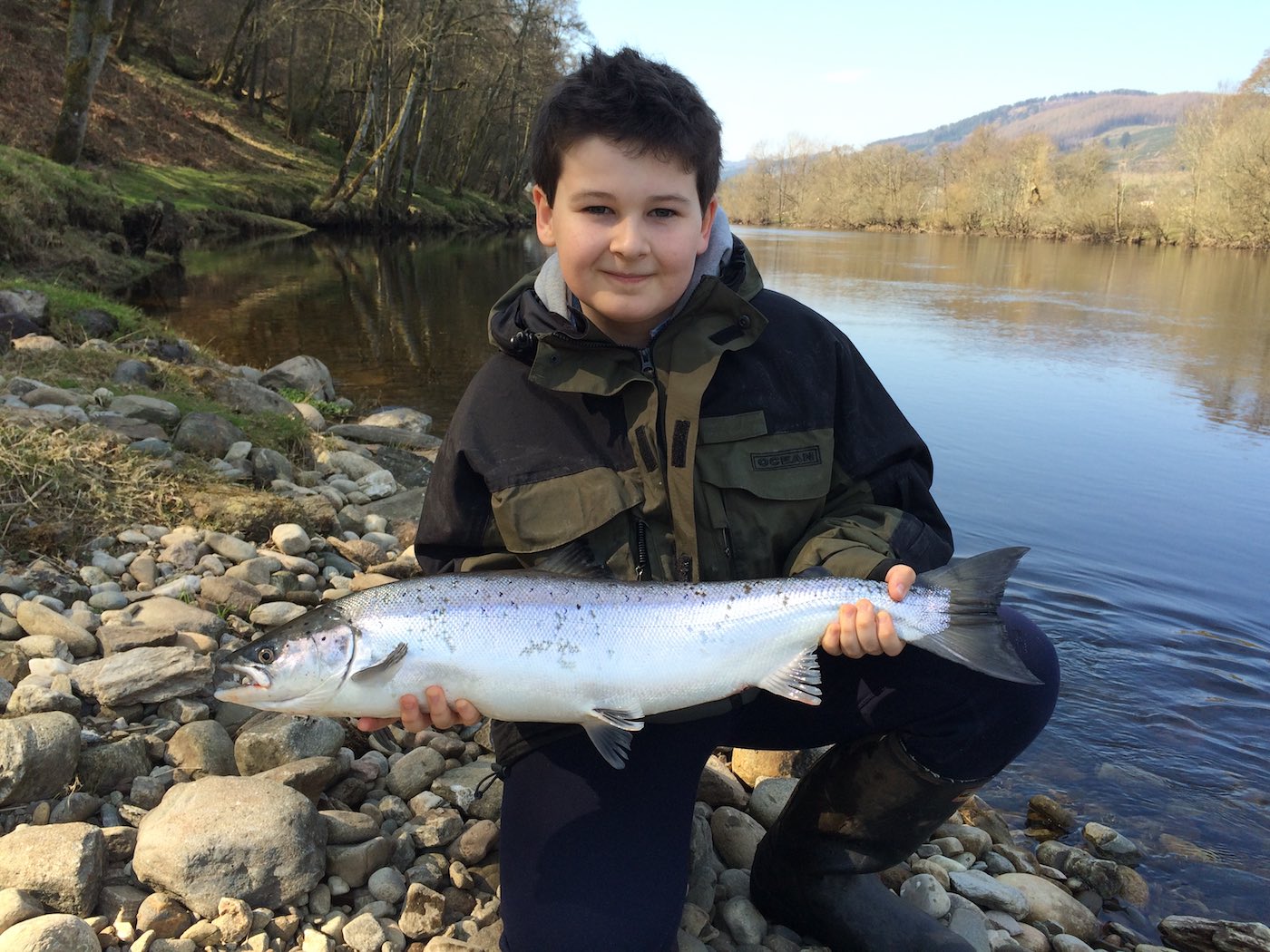 This is my son Johnny Monteith with a perfect fresh run Spring salmon from the Green Bank Pool on the Kinnaird Beat of the River Tay which was caught during April. I was honoured to be Johnny's salmon guide that day and managed to capture this fine photograph of the fish which was one of 3 fish he landed over his 3 day River Tay salmon fishing holiday.