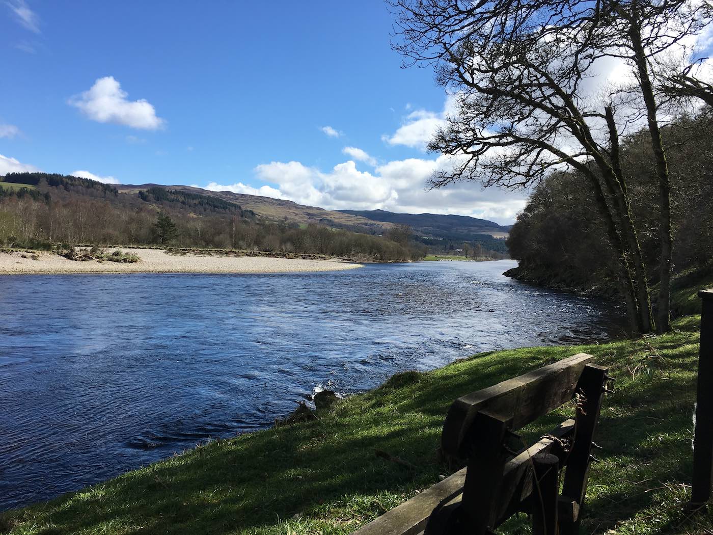 I sited this bench in this perfect elevated riverbank position after pulling it out of an upstream tree following a big January flood on the River Tay. This current position allows any occupier to have direct site of the upstream & downstream River Tay and also right up the River Tummel which is directly opposite the bench. This bench is a great resting location for Tay salmon fishing guides and guests and is sensibly positioned above the high water line.