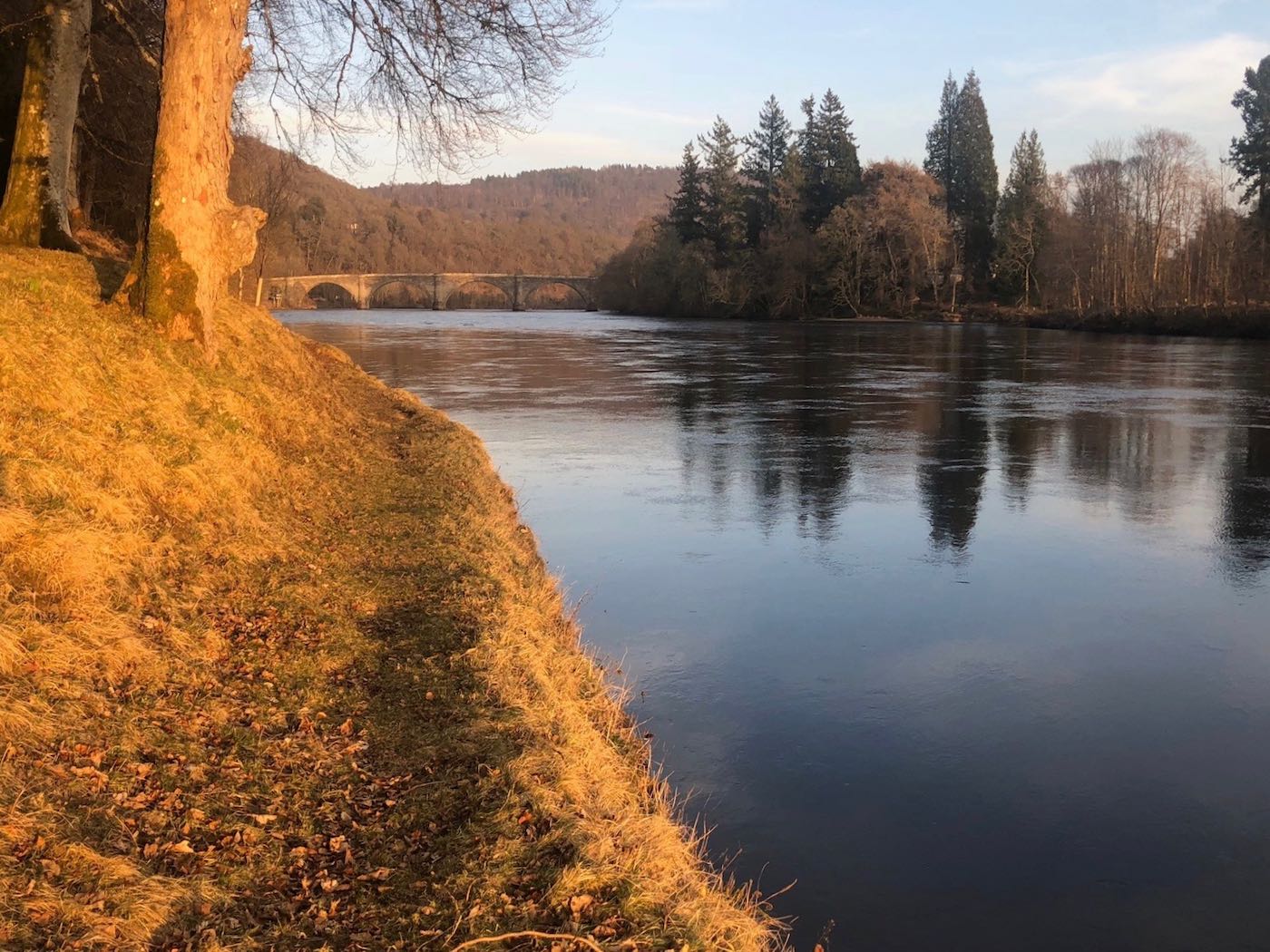 Here's an early Spring shot of the Gauge Tree Pool at Dunkeld on the River Tay. Look at the fast water in the distance which running salmon have to navigate before taking a well deserved rest in this productive salmon fishing pool. This lovely shot was taken at dusk by myself while working as a salmon guide when the final day's sunlight was perfectly illuminating this left hand bank of the river.