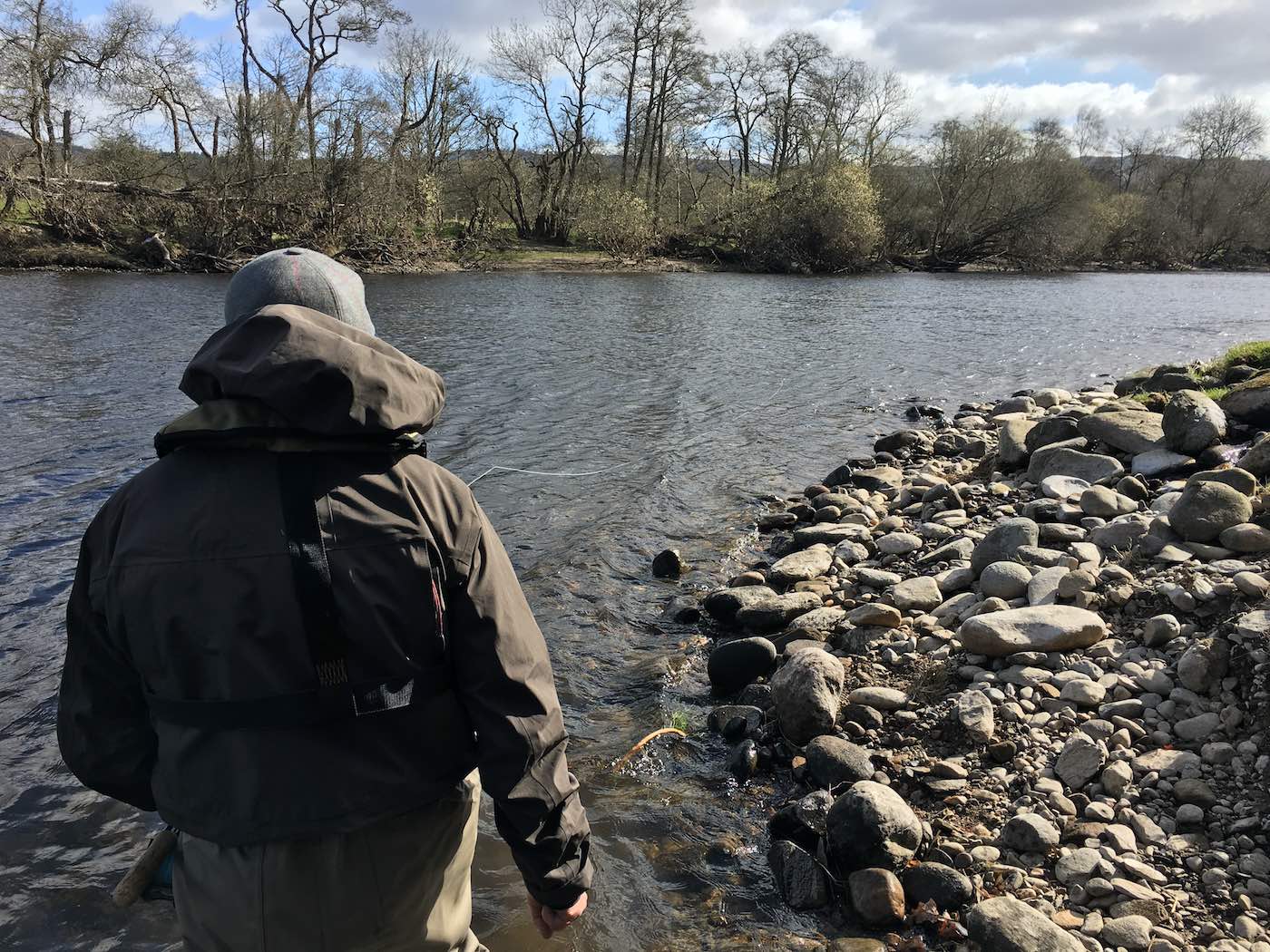 Here's one of our River Tay salmon fishing trip guests moments before a Spring salmon took his fly at the Green Bank Pool of the River Tay at Kinnaird. Careful salmon lie approach often pays off when fishing any salmon pool especially when salmon are suspected of lying close to the riverbank like this scenario. This fisher had come from California to fish the Tay and departed with a very special memory.