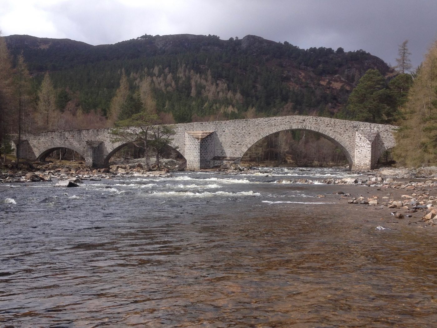 The headwaters of the River Dee in Aberdeenshire have some of the most amazing natural beauty where they merge with the Cairngorm Mountain range. The towns of Braemar & Ballater are located in the great fishing area of the River Dee Valley. This is the traditional stone bridge on the lovely Crathie salmon fishing beat.