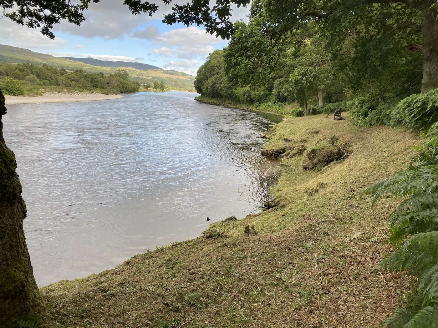 If you're in charge of a Scottish salmon beat then you should have a natural desire to maintain your riverbanks in top condition for your visiting salmon fishing guests. This pool is The March Pool on the River Tay near Pitlochry which I had just strimmed when I took this photograph. The tree on the left hand side of frame is a beautiful oak tree and you can just about see the dark coloured fisherman's bench 50 yards down the riverbank.