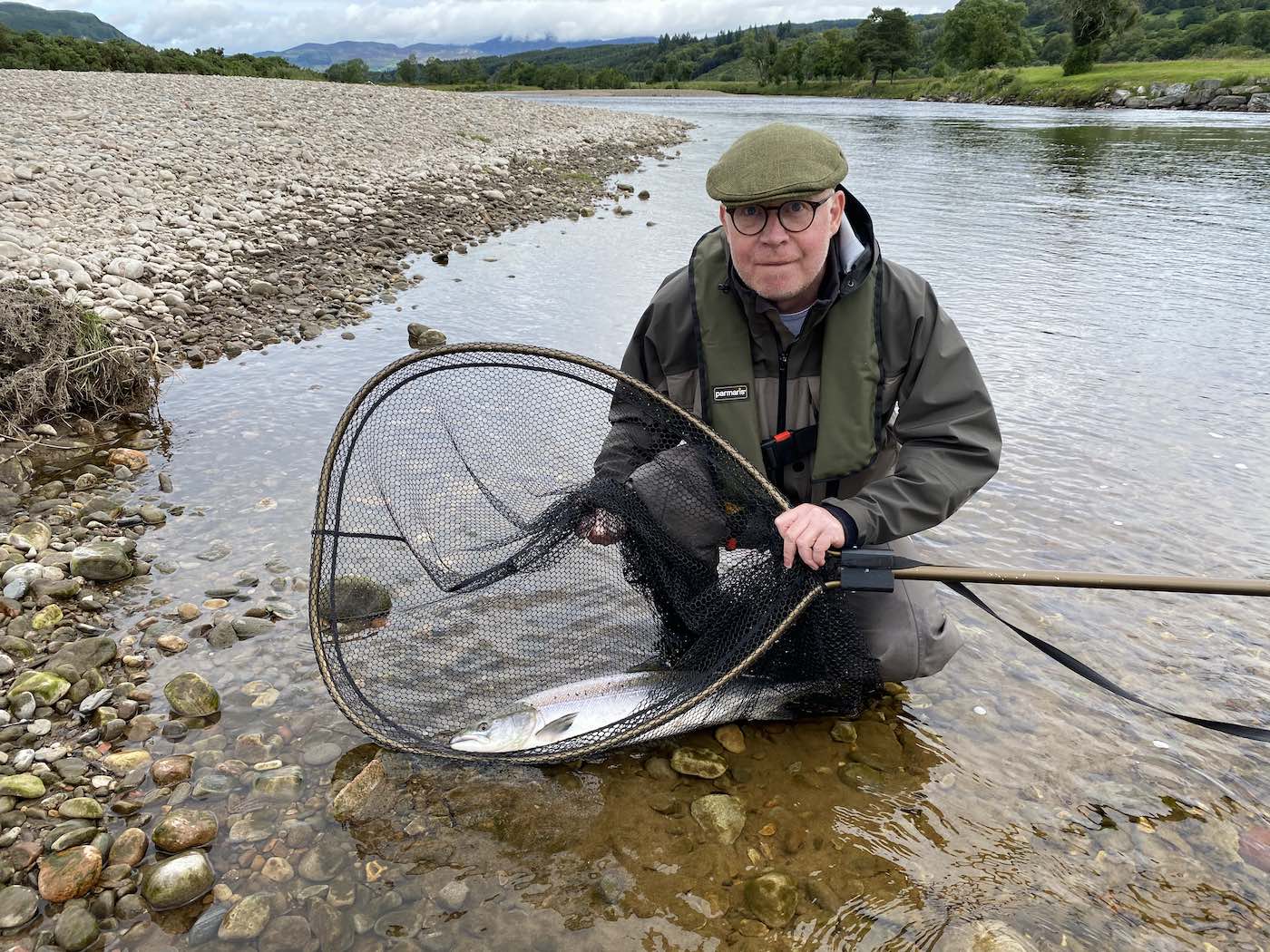 Here's a fine salmon capture photograph  for River Tay salmon angler Martin Hunter at the famous Ash Tree Pool of the River Tay near Dunkeld. A personal guide always provides a salmon fishing advantage and even to experienced salmon fishers like Martin. I was Martin's personal salmon guide that day and took this perfect salmon capture shot.