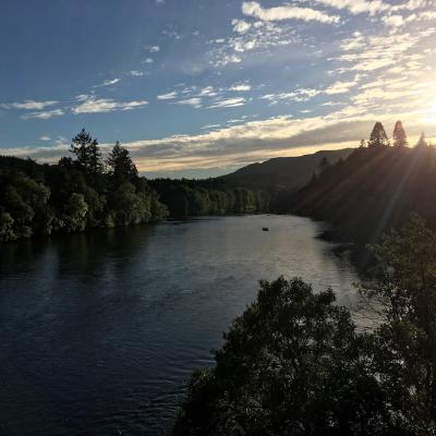 Here's a traditional River Tay salmon boat out fishing the Cathedral Stream at Dunkeld during the last hour of daylight. The sun is about to set over the Perthshire hills which it did 15 minutes after this lovely shot was taken from the Telford Bridge in Dunkeld.
