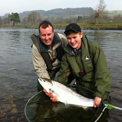 This young man landed 2 almost identical heavyweight Spring salmon during late March on the River Tay. He achieved this after a 30 minute crash course on how to use a double handed salmon rod on the Ash Tree Pool of the River Tay near Pitlochry. This was the 2nd Spring salmon he caught so I took this shot of him and his father while accompanying them as their personal salmon fishing guide. What a memorable morning that was!