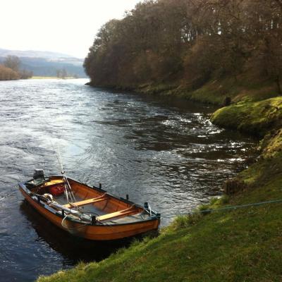 This perfect River Tay 'coble' boat at the ready stirs my blood in perfect water and light conditions like this. This photo was taken at the tail of the March Pool on the Kinnaird Beat of the Tay during Springtime.