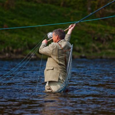 Here's a fine shot of the 'swing' which is the middle section of the Spey cast between the 'lift' and the 'power stroke'. Look how perfectly taut the salmon fly line is for perfect energy transfer and full fly line energy power retention. This fantastic action photograph was captured by at the Meetings Pool on the Lower Kinnaird salmon beat near Dunkeld. I was working as a professional salmon fly fishing instructor when this fine shot was taken on the River Tay.