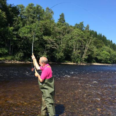 Here's an angler out on the River Tummel in the middle of a Spey casting lesson. The Spey cast is a highly functional salmon fly delivery cast which allows the fly fisher to present the fly when there's no room behind for an overhead cast. Many salmon anglers come to learn this casting technique while salmon fishing in Scotland with a professional fly fishing instructor.