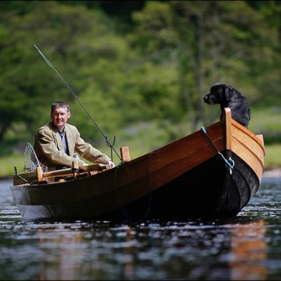 Here's a shot of myself while serving as a professional River Tay salmon fishing guide with my black labrador dog 'Selkie' out in the Cottar Pool of the Newtyle Beat near Dunkeld. This shot was taken by professional Scottish photographer Peter Sandground for the Glasgow Herald Magazine.