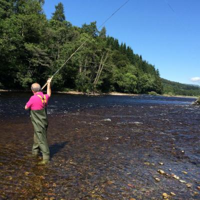 Here's a salmon fishing holiday guest in the middle of a Spey casting lesson on the River Tummel. The focus was on getting a visual of the anchor point which is the mid section of the cast where the front end of the Spey line briefly touches the surface of the river before being sent across the river. Watching this anchor point touch down assists with the timing of the power stroke as any experienced salmon fly fishing instructor will know.