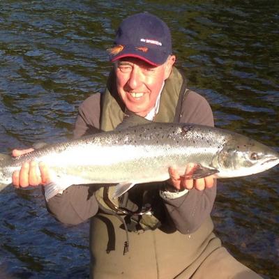 Keith had been trying to catch a salmon for a number of years before he was pointed to myself on the River Tay for his Sky TV Tight Lines programme. It took all of 10 minutes to put him into this fine River Tay salmon as his personal salmon fishing guide at the Boat Pool on the Glendelvine Beat. The Sky Sports cameras captured all of the footage and everyone went home happy and even the fish too which was released after this fine photo was taken. Note Keith is wearing a life jacket with his chest waders which is essential for safe wading reasons.