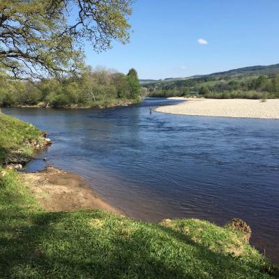 This lovely early Spring photograph shows a lone salmon fishing trip fisher over casting their fly at the mouth of the River Tummel where it enters the Tay. This is a perfect lowish water sunlit day for increased chances of catching a prized Spring salmon. I took this upstream facing photograph while serving as a salmon fishing guide.