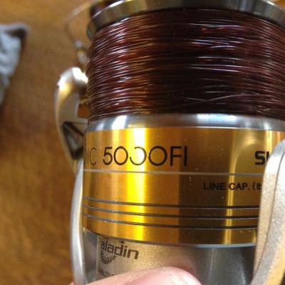 This salmon spinning reel was manufactured by Shimano and is known as a Stradic 5000. The fishing line on the spool is Maxima Chameleon in 18lbs breaking strain. I always add a few extra turns of line to the spool like you can see here just to add a bit of extra distance to each cast when working on a big wide river like the River Tay as a salmon fishing guide.