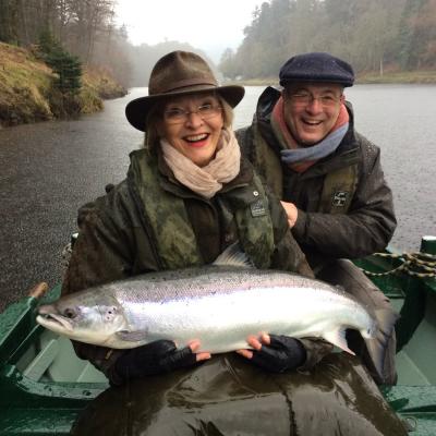 Here's a lady salmon fishing guest Mrs Caplin with a perfect March caught River Tay salmon of 23lbs which was caught upstream of the Dunkeld Bridge with the assistance of her professional salmon guide. This fish was caught on a cold wet Spring day but that didn't matter due to the accomplishment and excitement of the capture of this perfect Tay specimen.