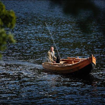 Here's Jock Monteith out in a traditional River Tay salmon boat in the Cottar Pool of the Newtyle Beat. This lovely shot was captured by top Scottish photographer Peter Sandground during late Spring. You can see 'Selkie' Jock's black labrador dog at the bow of the boat.