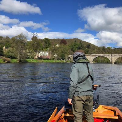 Here's a salmon fishing holiday guest in the traditional Tay salmon boat at the Telford Bridge in Dunkeld. You've got to manage your expectations in salmon fishing and stay consistent with a well thought out fishing plan and when you do that results will always follow. Note this salmon fisher is wearing a life jacket which is mandatory with all of our guided salmon fishing guests.