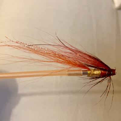If you get rid of the soft rubber sleeves that most tube flies come with and replace them with rigid plastic sleeves they will result in more solid hook sets as the hard version don't pivot and keep the hoof straight while being set by the angler. It's fairly tricky to fit a hard plastic sleeve but some patience and a bit of heat will do the job. This is a Jock's Shrimp tube fly which I tied on a copper tube fly body.