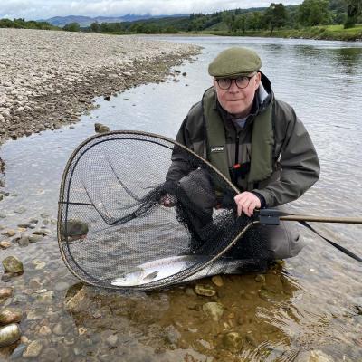 Here's a fine salmon capture photograph  for River Tay salmon angler Martin Hunter at the famous Ash Tree Pool of the River Tay near Dunkeld. A personal guide always provides a salmon fishing advantage and even to experienced salmon fishers like Martin. I was Martin's personal salmon guide that day and took this perfect salmon capture shot.
