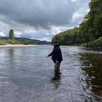 Learning to fish for salmon on Scotland's largest and most famous salmon river is a real natural thrill under the supervision of a professional salmon guide. This picture was taken on the River Tay near Logierait with a guided salmon fisher out presenting his salmon fly through a well know salmon fishing hot spot during July.