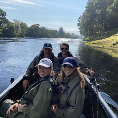 This family fishing party came to the Tay for an introduction to Scottish salmon fishing during July. The young lady with the white cap landed her first ever fly caught salmon that day much to the amazement of her onlooking family members. Look at the perfectly cut riverbank to the right hand side of the traditional Tay salmon fishing boat.