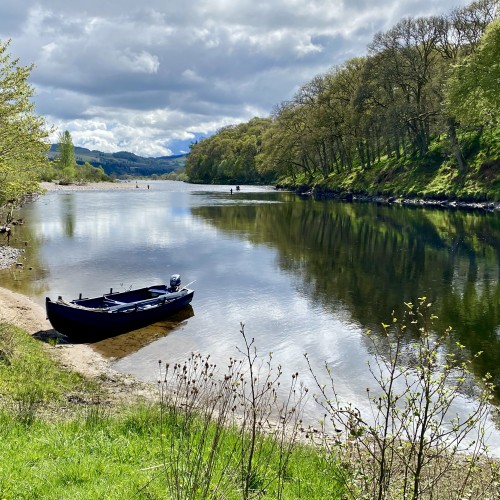 Here is a traditional River Tay harling boat moored on the lovely sandbank at the Kinnaird Beat Rock Pool. The 2 salmon anglers on the right hand side of the river with their professional guide had just landed their 2nd salmon when I took this perfect shot. This fishing area of the Tay is between Pitlochry & Dunkeld where the River Tummel greets the Tay and is a renowned hot spot. The deep water to the right hand side of the boat is a serious salmon holding pool that our salmon guides love to take salmon fishing guests to.