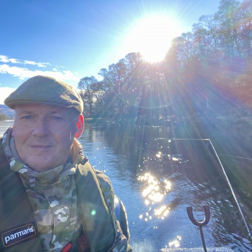 There's nothing more inspiring than the low Scottish sun appearing through the clouds on a cold early Spring fishing day to warm up the surface layer of the freezing cold river water as you can see in this photograph. This warmth is often an indicator trigger preceding the capture of an early Spring salmon so whenever I see this my expectation levels soar. I took this selfie during the early Spring month of February on the River Tay while out fishing from the boat near the River Tummel mouth.
