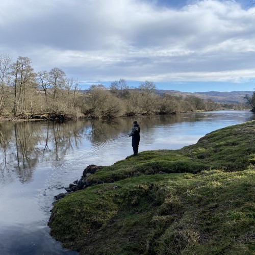 I took this shot of this salmon fishing guest spinning through the Green Bank pool on the River Tay near Pitlochry. You can see from the bare trees this shot was taken during early Spring. The spinner offers a salmon fisher the ability to cover much more water on a big river than what could realistically be achieved with a fly rod. This significantly increases the chance of a salmon take on big rivers like the River Tay in Perthshire but only if good riverbank cast spacings are added to the tactical spin approach.