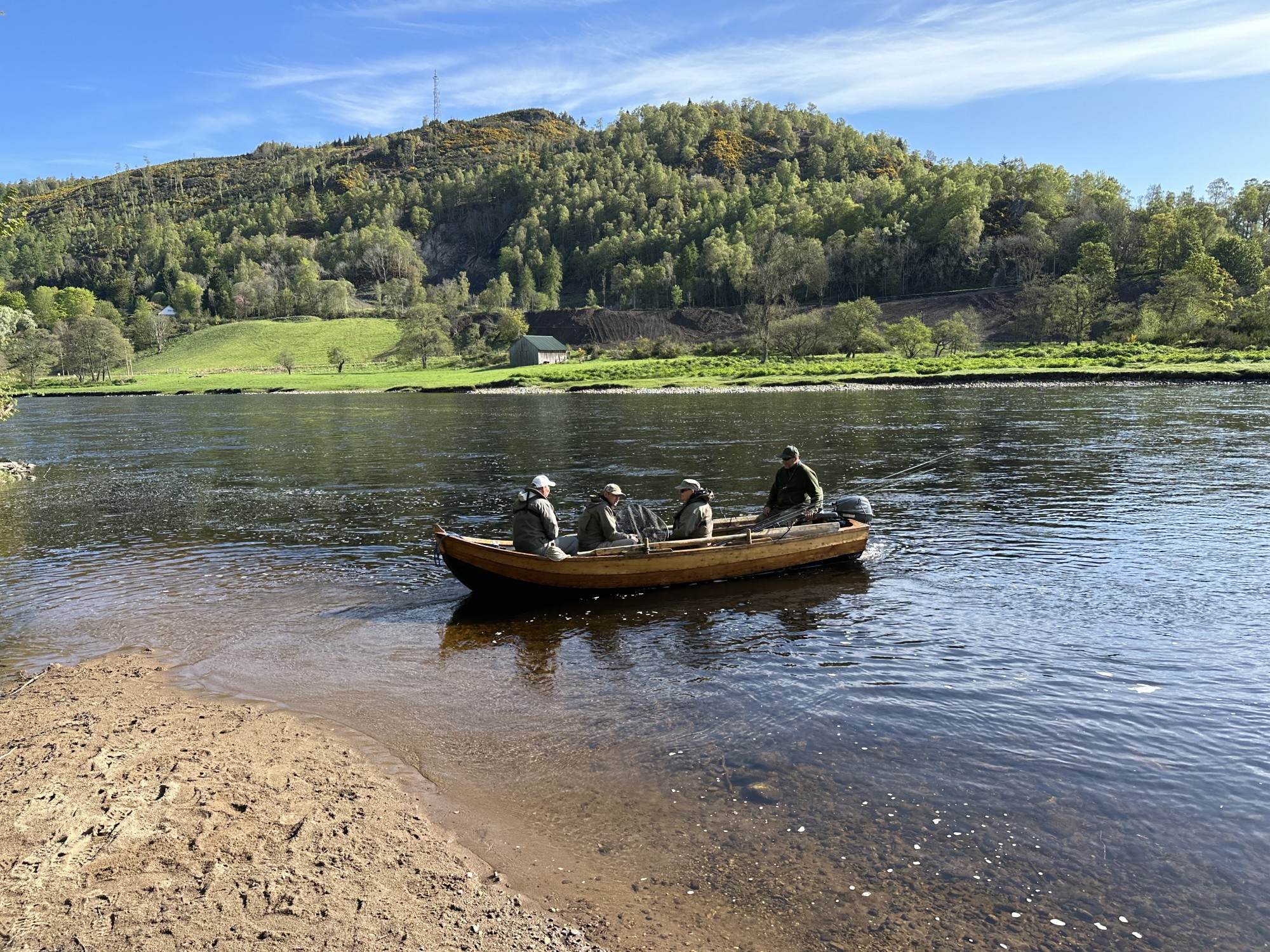 I took this shot of a boat load of visiting salmon fishers being brought back over to the fishing hut  for their lunch on the River Tay near Birnam. The boats on this beat have been kept on this sandy riverbank for over 60 years. You can see the boathouse on the far riverbank which I built in 2007 while I was working on this Tay salmon beat as the Head Ghillie.