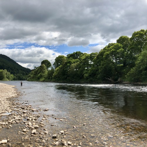I took this beautiful downstream shot of the River Tay in Perthshire which is a famous Scottish salmon river. This lovely shot was taken a few miles upstream from the Perthshire town of Dunkeld. You can clearly see my salmon fishing guest a few hundred yards below me. The dark shadowy water just off the main current is a great Tay salmon holding area and is always worth fishing through.