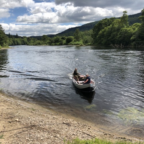 I took this shot of a traditional River Tay salmon fishing boat coming in for lunch with a salmon fishing guest and his professional ghillie. This shot was taken on the lovely Dalmarnock Beat near Dunkeld in Perthshire during the month of June. This sandy bay is a great low water location to keep the boat at.