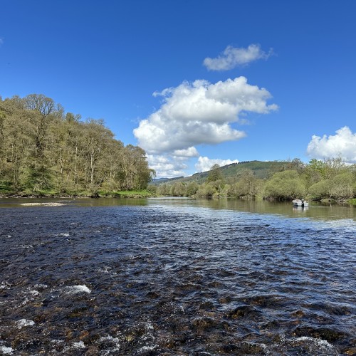 Here's an upstream shot of the River Tay which was taken from the shallow mid stream gravel bar at the neck of the Rock Pool. You can clearly see the salmon fishing boat moored upstream awaiting my return. I took this shot during a bright light day in March.