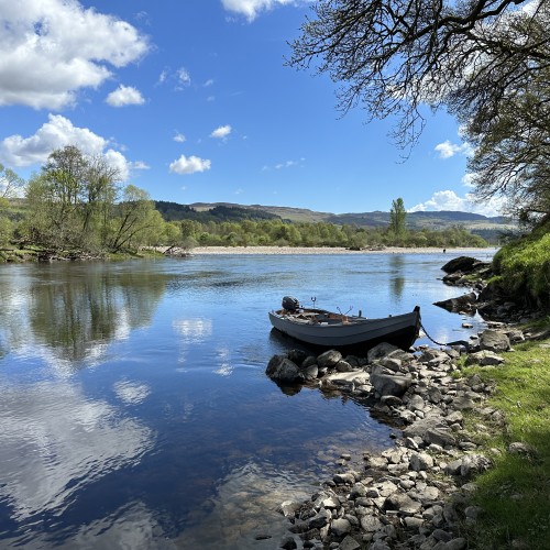 This is the Rock Pool on the River Tay slightly upstream of the River Tay & River Tummel confluence which is just visible in the background. This is a very good salmon fishing area in Scotland and worthy of a salmon fishing trip. I took this beautiful shot in low water conditions during June after commuting down in this traditional Tay salmon boat.