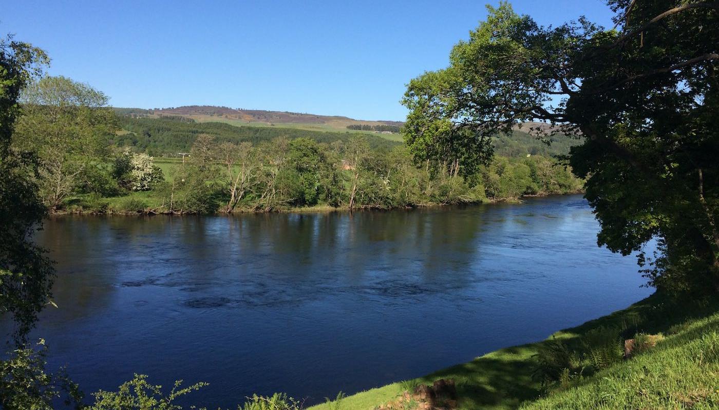 The River Tay is a tantalisingly beautiful Scottish river as you can clearly see here. This shot shows the lovely overhanging oak tree and the perfect cut riverbanks directly outside the Kinnaird fishing hut which is positioned slightly downstream of the Logierait Bridge.  I took this perfect river shot while working on Kinnaird as a salmon fishing guide and tactical salmon fishing tuition provider.